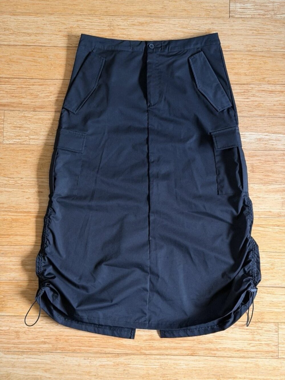Women’s Black Solid Cargo Knee-Length Skirt Pockets Button Closure Drawstring